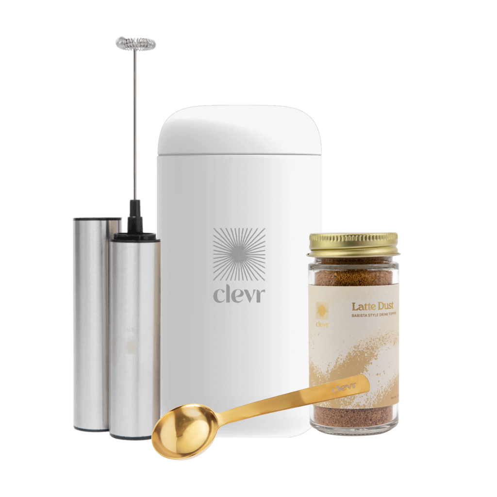 Kit accessories: a thermos, a frother, latte dust, and a golden scoop.